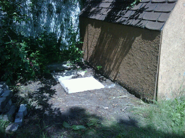 platform-on-which-rain-barrels-sit rain barrels sit on sidewalk blocks and then cinder blocks