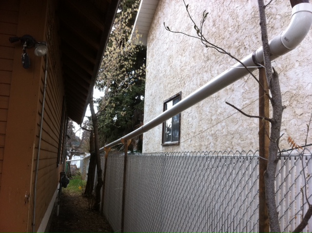 pvc-pipe-moves-water-to-rear-of-house