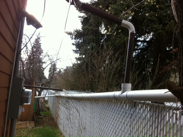 water-routed-into-pvc-pipe eavestroughs empty into PVC Pipe